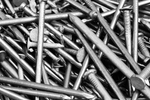 Close-up of a pile of various types of construction nails