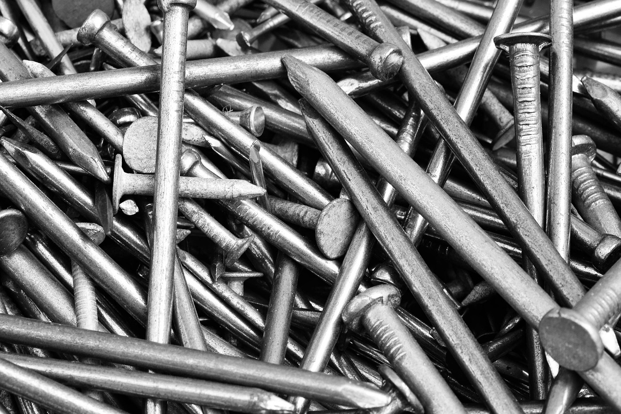 Close-up of a pile of various types of construction nails