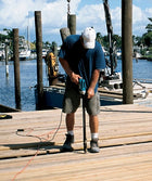 Using the SSDTH collated stainless steel trim screw to install new boards on a wooden dock; Line drawing of the SSDTH stainless steel trim screw.  Square drive, box threading