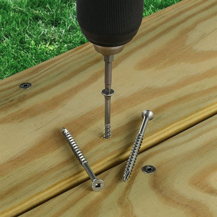 Stainless Steel Bugle Screw with Square Drive;  Square drive bugle head screw being installed into a deck board.  Installed screw square drives are visible and 2 screws lay on top of the deck displaying it's drive, head, threading and point.; Bugle Head Screws, stainless steel, being installed into a wood deck outdoors.  Screws on display on deck showing screw drive, head, threading and point.