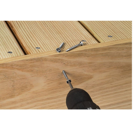 Stainless Steel Bugle Screw with Square Drive;  Square drive bugle head screw being installed into a deck board.  Installed screw square drives are visible and 2 screws lay on top of the deck displaying it's drive, head, threading and point.; Bugle Head Screws, stainless steel, being installed into a wood deck outdoors.  Screws on display on deck showing screw drive, head, threading and point.
